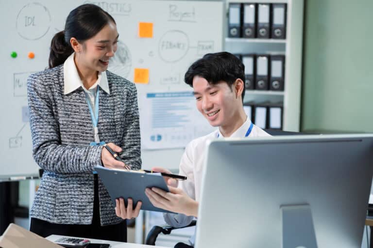 Businessmen team or financial data analysts working with tablets and laptop computers and data graphs together. Plan to analyzing projects in the office.